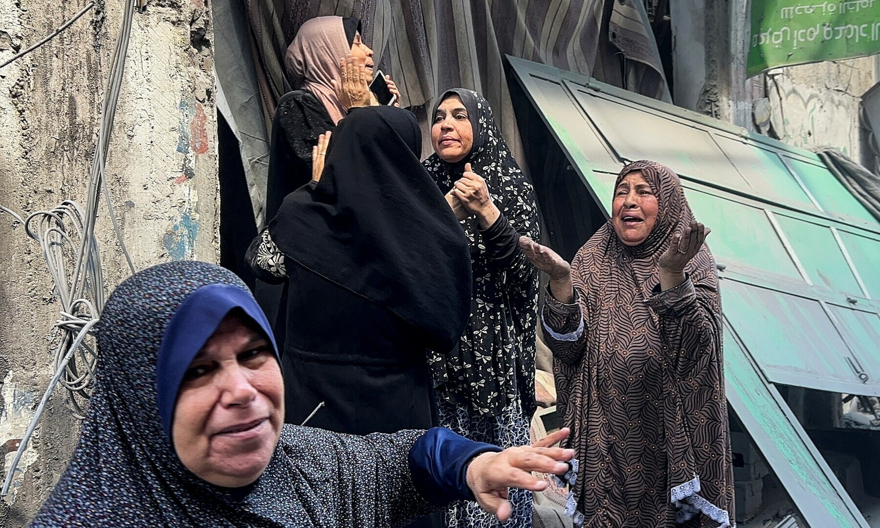 Palestinians react at the site of an Israeli strike on a house in Shejaia, in Gaza City on April 10, 2025. — Reuters/Stringer