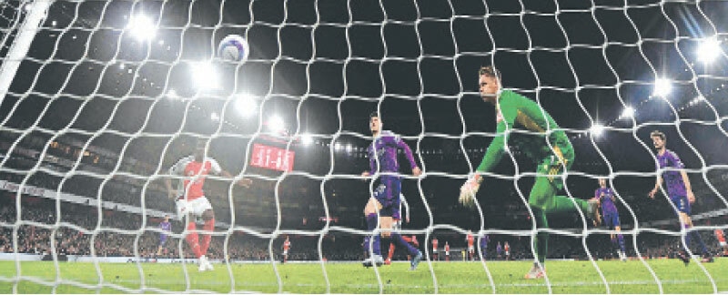 LONDON: Arsenal&rsquo;s Bukayo Saka (L) scores during the Premier League match against Fulham at the Emirates Stadium.&mdash;AFP