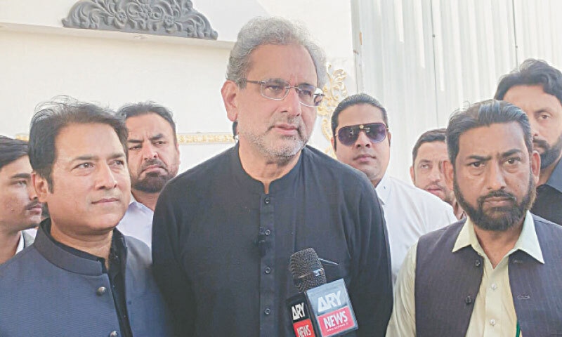 Shahid Khaqan Abbasi talking to mediapersons in Dera Ismail Khan on Friday. &mdash; Dawn