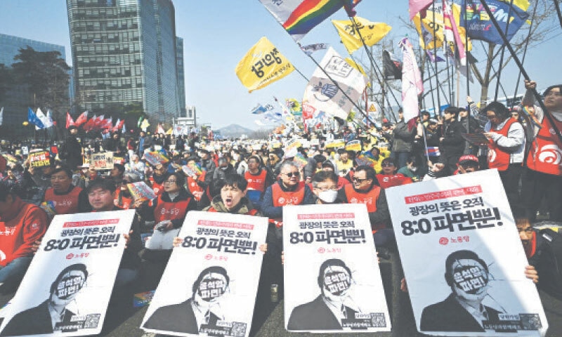 Anti-Yoon protesters wait for the Constitutional Court’s verdict on the impeachment of South Korean President Yoon Suk Yeol in Seoul, on Friday.—AFP