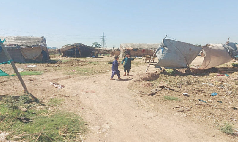Slum dwellers reoccupy a part of Sector I-12. &mdash; Dawn