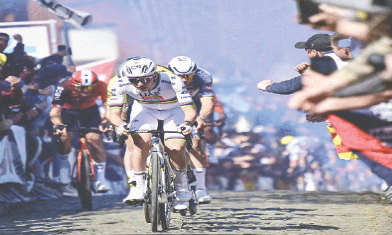 UAE Team Emirates’ Tadej Pogacar of Slovenia competes in the Tour of Flanders, a 268.9km distance from Brugge to Oudenaarde, on Sunday.—AFP UAE Team Emirates’ Tadej Pogacar of Slovenia competes in the Tour of Flanders, a 268.9km distance from Brugge to Oudenaarde, on Sunday.—AFP