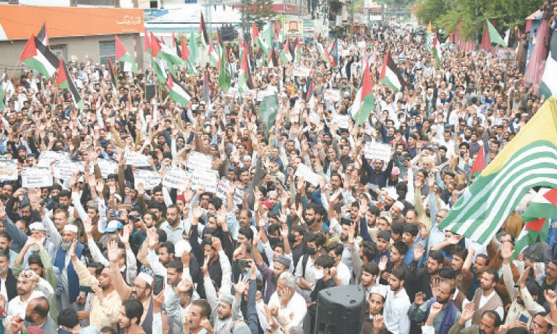 Protesters raise slogans during a rally brought out to express solidarity with the Palestinians in Muzaffarabad on Saturday. &mdash; Online