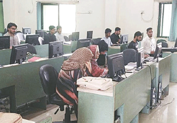 Students seen finalising their assignments at the university&rsquo;s main computer laboratory. &mdash;  Photos by Mohammad Asim