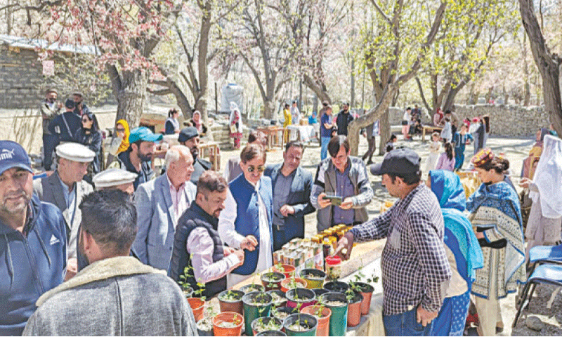 GB Assembly member from Hunza Ubaidullah Baig as well as officials from the agriculture department and district administration visit a stall displaying local products during the Spring Blossom Festival in Gulmit. — Dawn GB Assembly member from Hunza Ubaidullah Baig as well as officials from the agriculture department and district administration visit a stall displaying local products during the Spring Blossom Festival in Gulmit. — Dawn