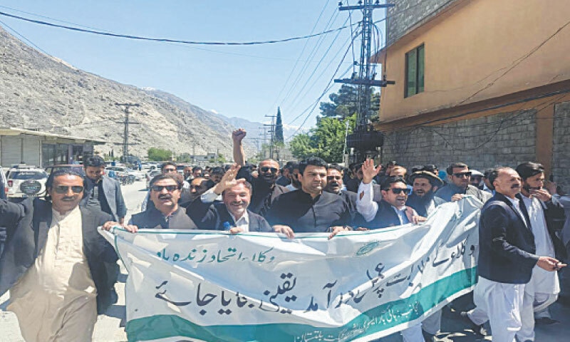 The protest rally passes through GB Chief Court building in Kondas, Gilgit on Monday. &mdash; Dawn
