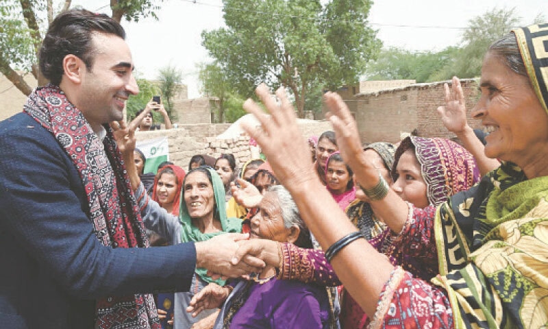 PPP Chairman Bilawal Bhutto-Zardari interacts with flood-affected people during his visit to a village near Hyderabad.&mdash;PPI