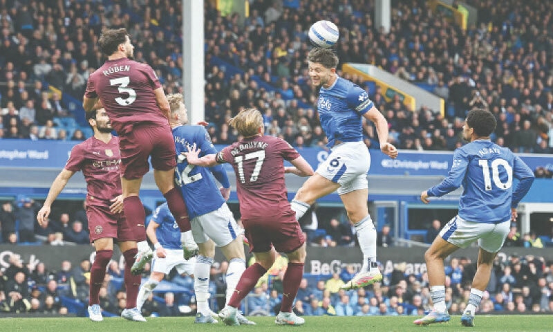 LIVERPOOL: Everton&rsquo;s James Tarkowski wins a header during the English Premier League match against Manchester City at Goodison Park on Saturday.&mdash;AFP