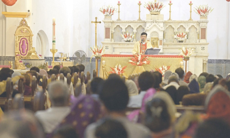 A pastor conducts an Easter mass at St Joseph Catholic Church in Rawalpindi&rsquo;s Lalkurti area on Sunday. &mdash; Photo by Mohammad Asim