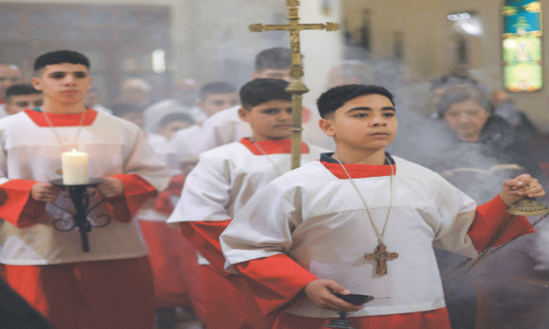 Palestinian Christians attend a mass at Gaza City’s Holy Family Church after the death of Pope Francis was announced.—Reuters Palestinian Christians attend a mass at Gaza City’s Holy Family Church after the death of Pope Francis was announced.—Reuters