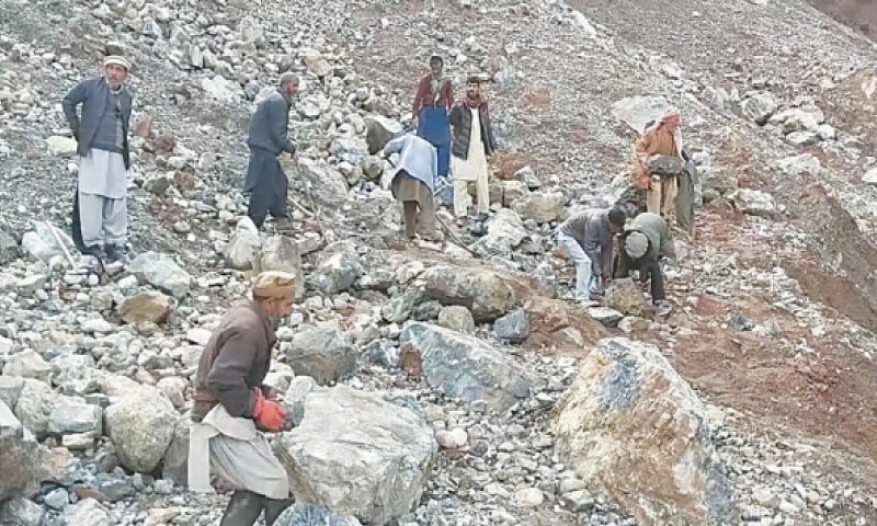 Villagers of Reshun in Upper Chitral collect boulders to erect a bulwark on the riverbank. — Dawn Villagers of Reshun in Upper Chitral collect boulders to erect a bulwark on the riverbank. — Dawn