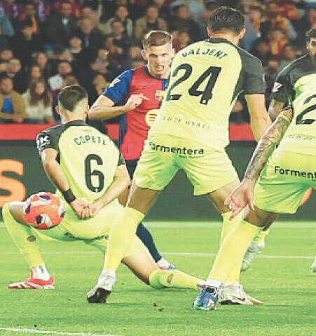 BARCELONA: Barcelona&rsquo;s Dani Olmo (second L) scores during the La Liga match against Mallorca at Estadi Olimpic Lluis Companys.&mdash;Reuters