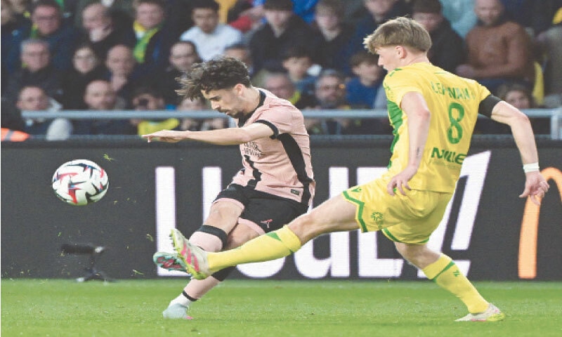 NANTES: Paris St Germain&rsquo;s Vitinha kicks the ball past Nantes&rsquo; Johann Lepenant during the Ligue 1 match at the Stade de la Beaujoire&ndash;Louis Fonteneau.&mdash;AFP