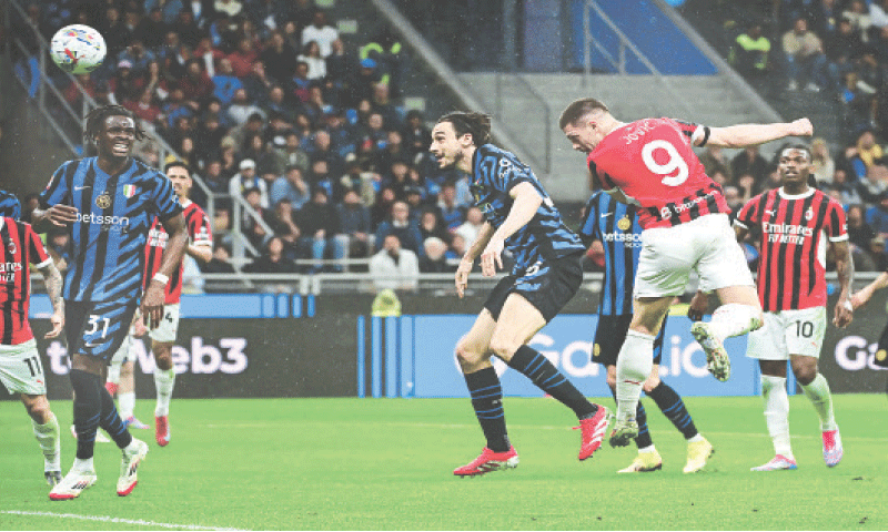 AC MILAN’S Luka Jovic (second R) heads to score against Inter Milan during their Coppa Italia semi-final second leg at San Siro.—AFP AC MILAN’S Luka Jovic (second R) heads to score against Inter Milan during their Coppa Italia semi-final second leg at San Siro.—AFP