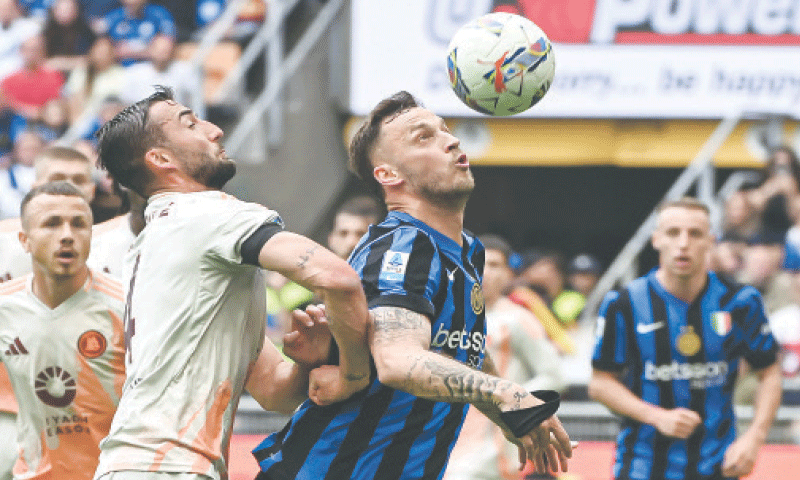 MILAN: Inter Milan&rsquo;s Marko Arnautovic heads next to AS Roma&rsquo;s Bryan Cristante during their Serie A match at San Siro on Sunday.&mdash;AFP