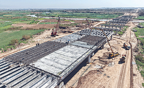 A deck slab work continues over Soan River bridge.