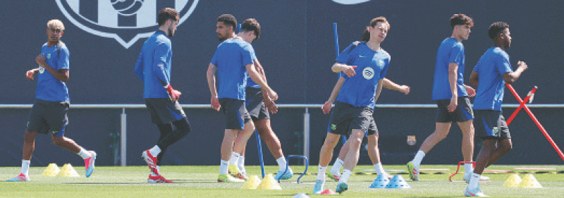 BARCELONA: Barcelona players attend a training session at the Joan Gamper training ground on Tuesday.—AFP