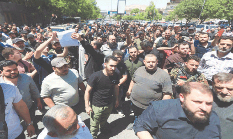 Damascus: Demonstrators chant slogans during the funeral of a man who was killed during clashes on Monday night.&mdash;AFP
