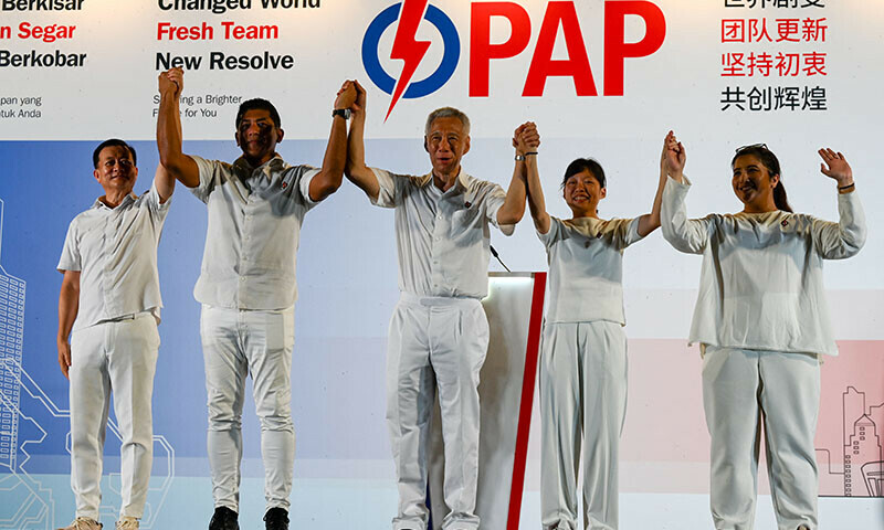 Singapore Senior Minister Lee Hsien Loong (C) of the People&rsquo;s Action Party greets supporters at the party&rsquo;s gathering centre during the general election results in Singapore on May 3. &mdash; AFP