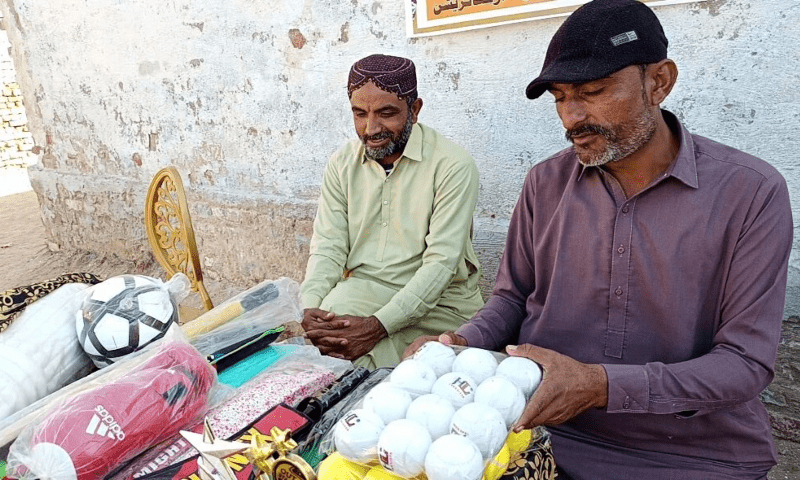  Hammaduddin with some sports goods from his shop. &mdash; Photo by the author 