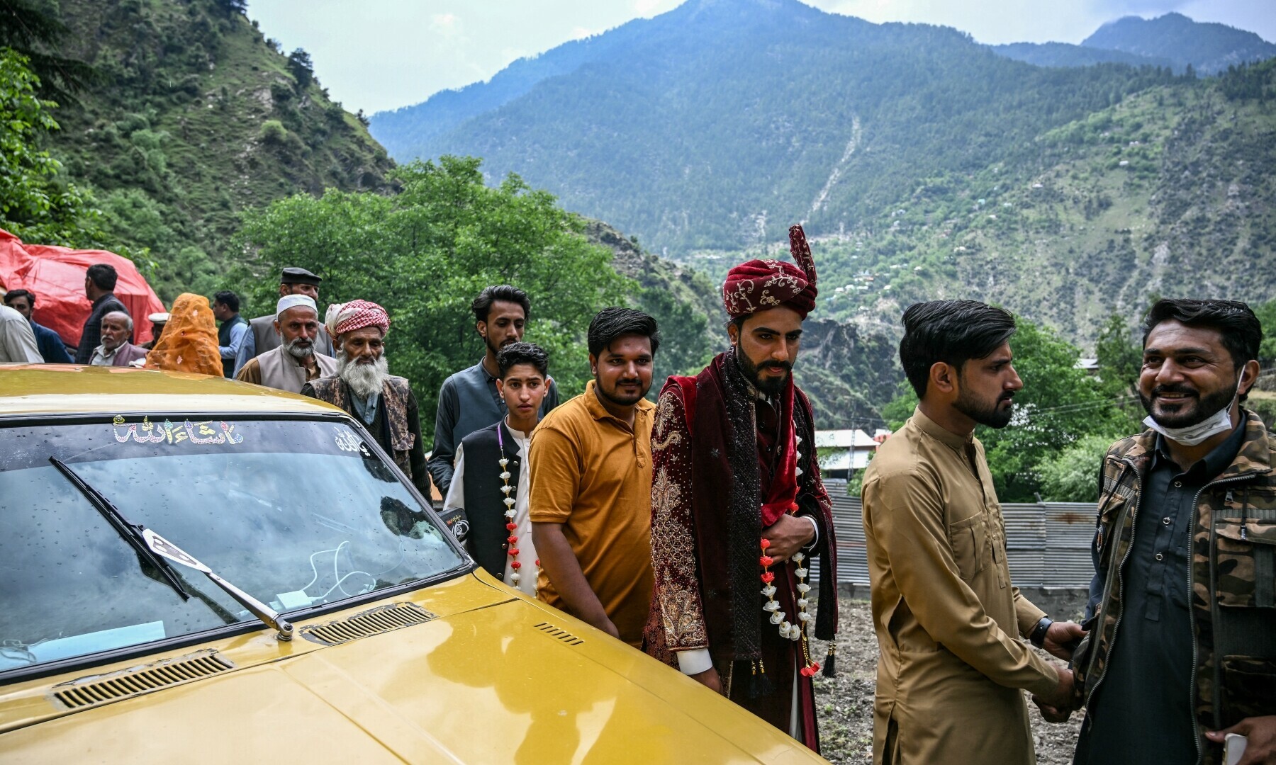 Groom Chaudhry Junaid (C) arrives during his wedding ceremony in Ashkot village on the Line of Control (LoC) in Neelum Valley, a district of Azad Jammu and Kashmir, on May 3. — AFP