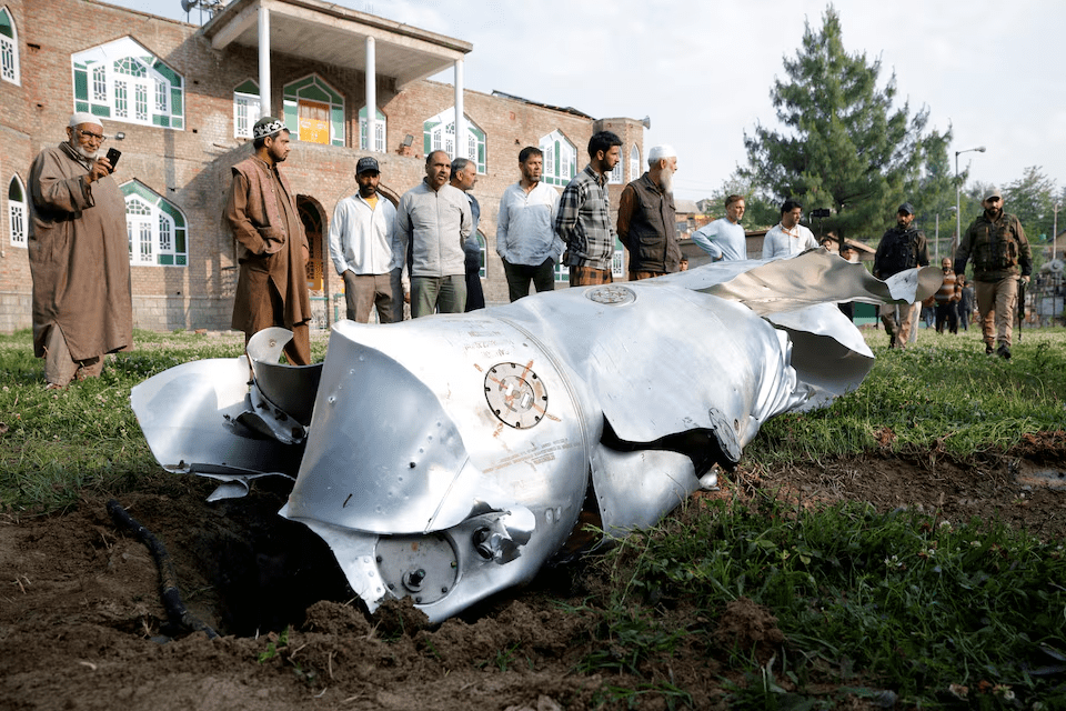 People stand near a fuel tank of an aircraft in Wuyan near Indian-administered Kashmir&rsquo;s main city of Srinagar on May 7, 2025. It remains unclear whether the image shows wreckage of the same aircraft referenced by the French official.  &mdash; AFP