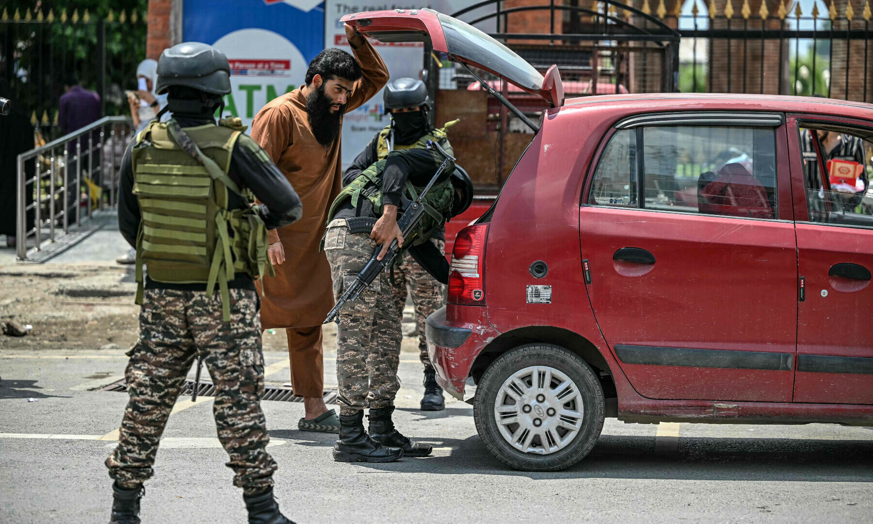  Indian paramilitary soldiers inspect a vehicle in Srinagar in occupied Kashmir on May 11, 2025. &mdash; AFP 