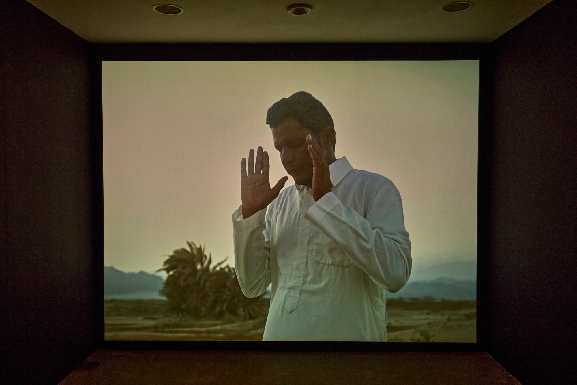  A video component featuring Mahtab Hussain in prayer. &mdash; David Rowan 