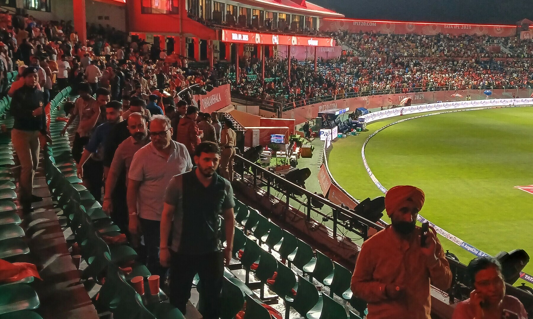 Spectators leave after the Indian Premier League (IPL) Twenty20 cricket match between Punjab Kings and Delhi Capitals was abandoned due to a significant technical failure at the Himachal Pradesh Cricket Association Stadium in Dharamsala on May 8, 2025. &mdash; AFP