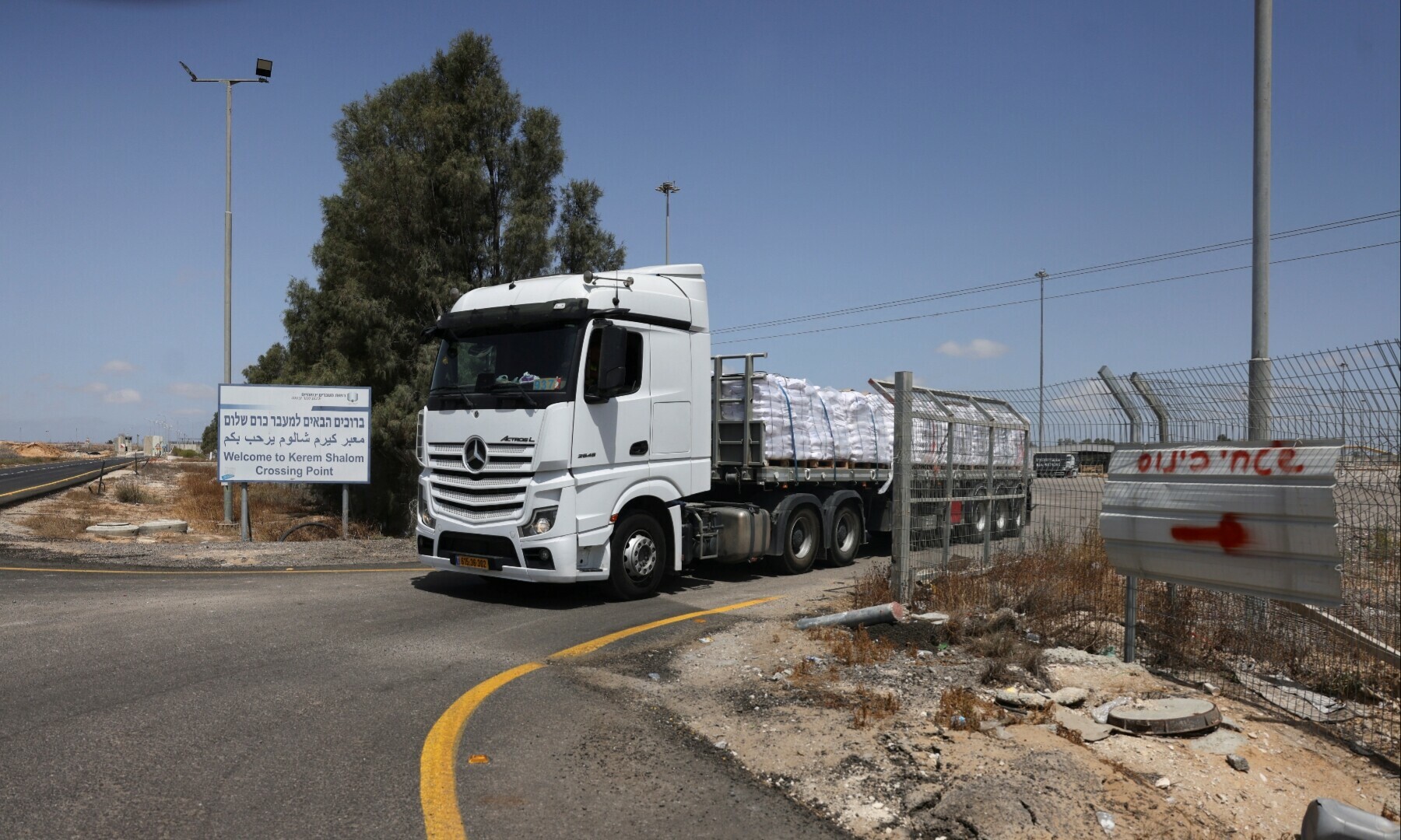  A truck carrying items makes its way to Gaza, at the Kerem Shalom crossing, on the Israeli side of the crossing on May 19, 2025 &mdash; Reuters/Ronen Zvulun 