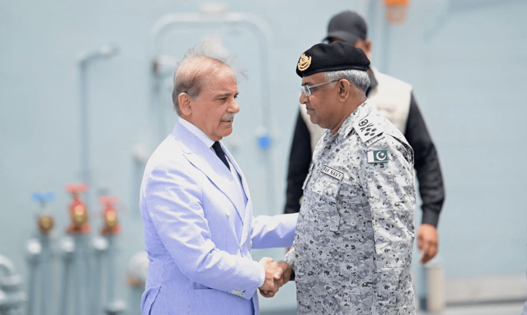PM Shehbaz Sharif is received by Naval chief Admiral Naveed Ashraf upon his arrival at the Naval Dockyard in Karachi on May 19, 2025. &mdash; PID