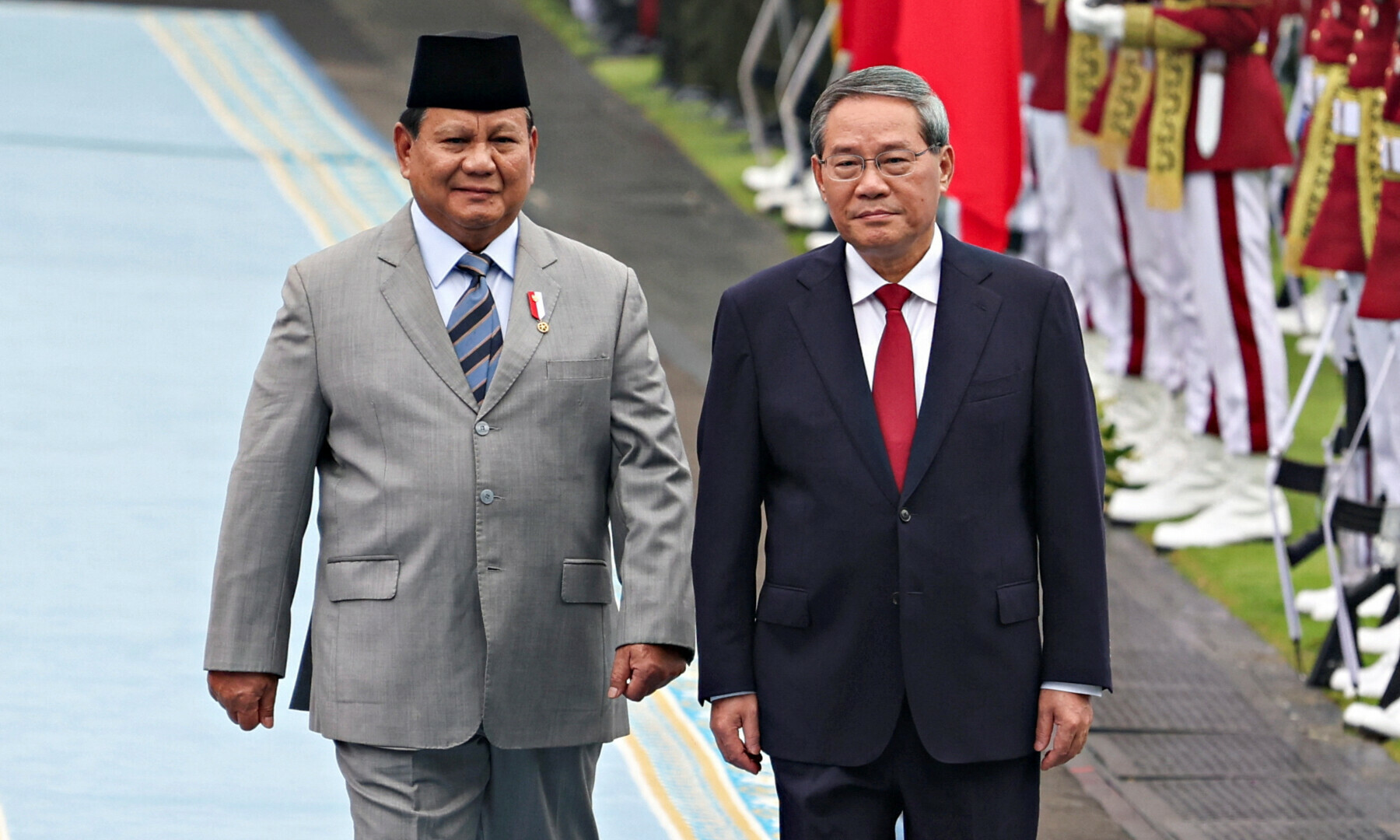 Indonesian President Prabowo Subianto with Chinese Premier Li Qiang inspect the guard of honour during a welcoming ceremony, on the day of their meeting, at the Merdeka Palace in Jakarta, Indonesia, on May 25, 2025. — Reuters/Ajeng Dinar Ulfiana
