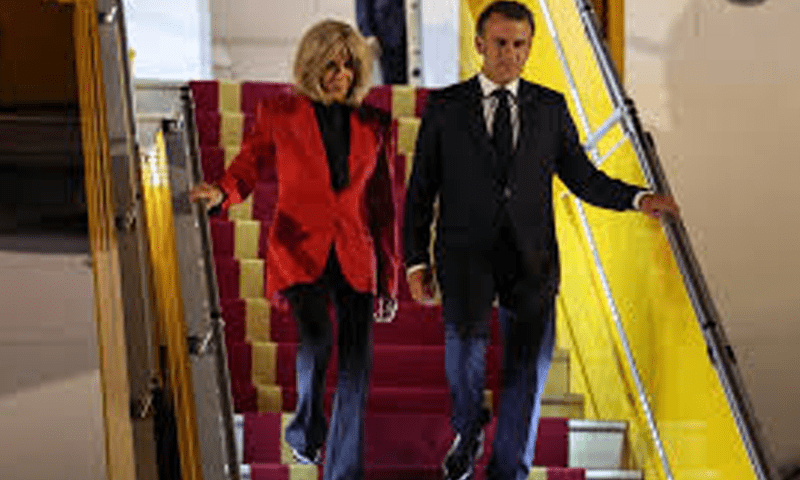 French President Emmanuel Macron and his wife Brigitte Macron exit the presidential plane following an alleged altercation in Hanoi, Vietnam on May 26. &mdash; DawnNewsTV