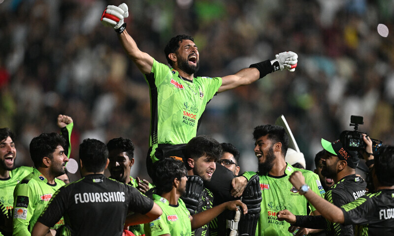 Lahore Qalanders’ players carry teammate Sikandar Raza as they celebrate after their victory in the Pakistan Super League (PSL) Twenty20 final cricket match between Lahore Qalandars and Quetta Gladiators at the Gaddafi Stadium in Lahore on May 25. — AFP