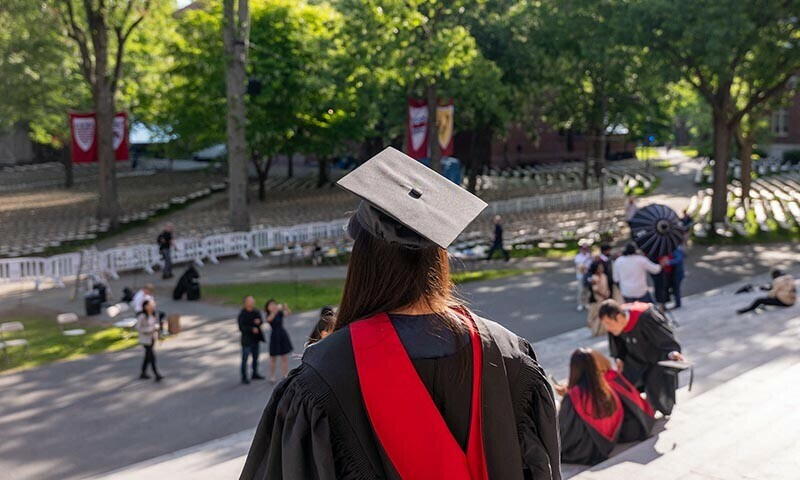 Graduating students, faculty, and family gather in Harvard Yard on May 28 in Cambridge, Massachusetts, the US. &mdash; AFP
