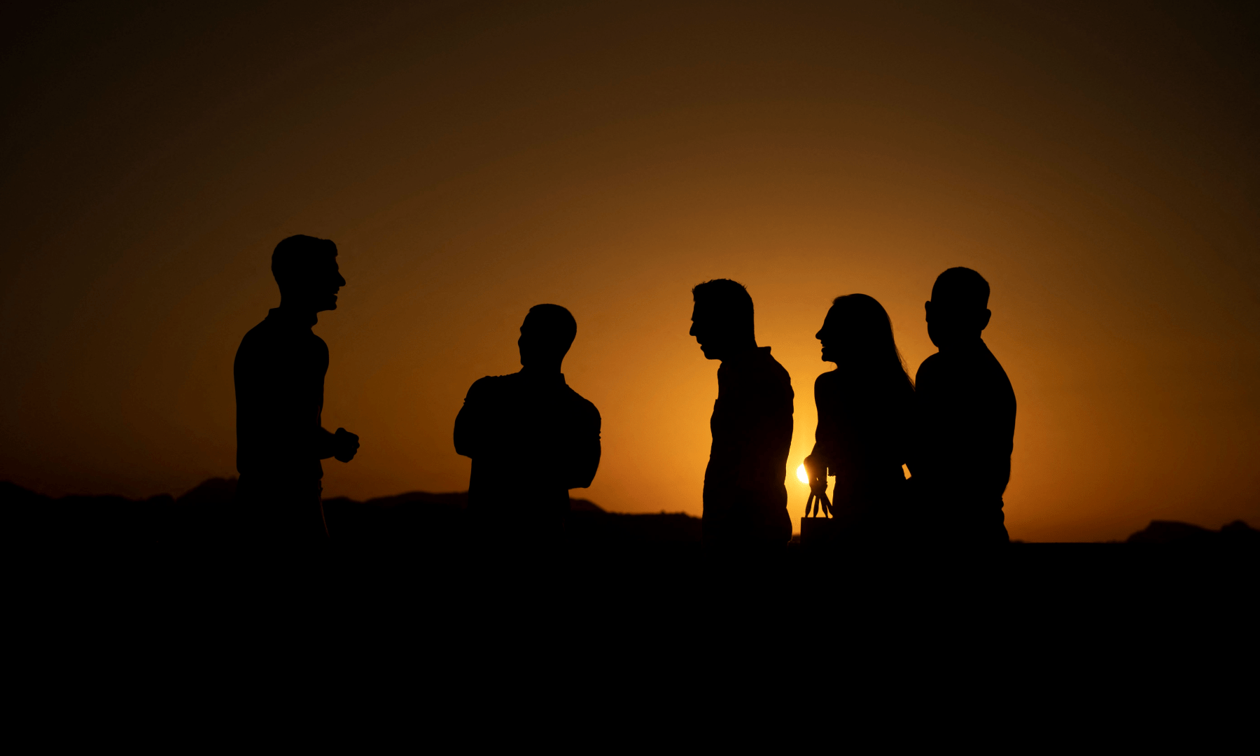 People socialise during sunset in Ronda, southern Spain as the country faces the first heatwave of the season, on May 28, 2025. — AFP
