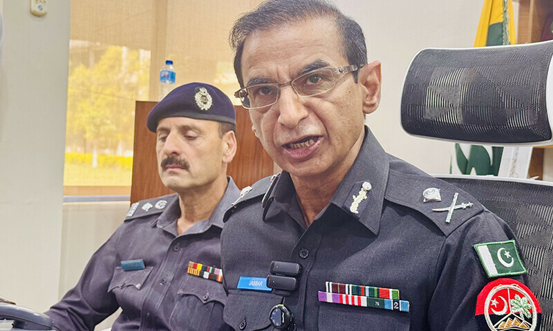 Flanked by SSP Poonch Riaz Mughal, AJK&rsquo;s police chief Rana Abdul Jabbar speaks at a press conference in his office in Muzaffarabad on Thursday.  &mdash; Author