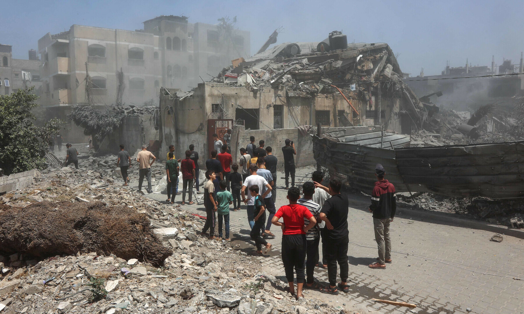 Palestinians inspect the rubble following Israeli strikes on the al-Qattaa family home in al-Tuffah neighbourhood in Gaza City on May 31, 2025. — AFP