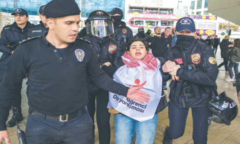 Turkish police detain a protester during a May Day rally in Istanbul on Thursday.—AFP