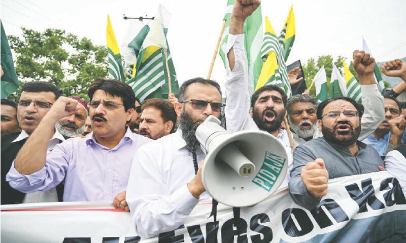 MUZAFFARABAD: Activists and supporters of the All-Parties Hurriyat Conference take part in an anti-India protest.&mdash;AFP