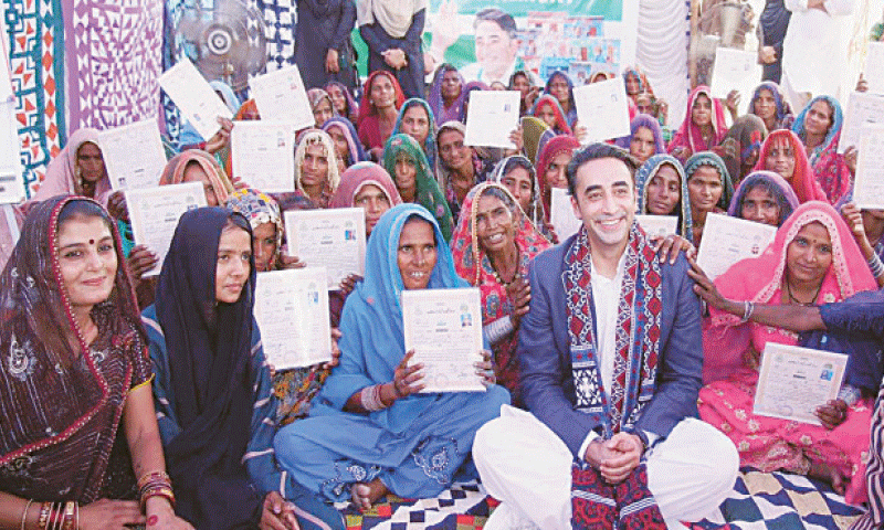 PPP Chairman Bilawal Bhutto-Zardari sits with village women at a ceremony, held to distribute ownership documents of the houses rebuilt by the Sindh government in Mirpurkhas.—Dawn PPP Chairman Bilawal Bhutto-Zardari sits with village women at a ceremony, held to distribute ownership documents of the houses rebuilt by the Sindh government in Mirpurkhas.—Dawn