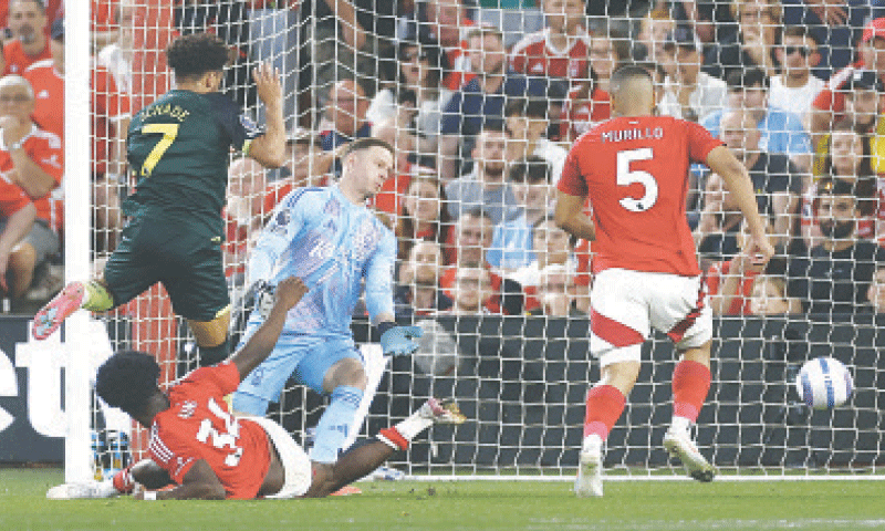 Brentford’s Kevin Schade (L, above) scores against Nottingham Forest during their Premier League match at The City Ground.—Reuters Brentford’s Kevin Schade (L, above) scores against Nottingham Forest during their Premier League match at The City Ground.—Reuters