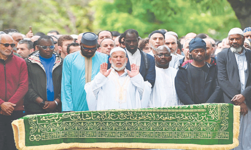 Salim Touazi (centre), Imam of the Khadija Mosque, prays before the coffin of Aboubakar Cisse, a worshipper stabbed to death inside the mosque on April 25.—AFP Salim Touazi (centre), Imam of the Khadija Mosque, prays before the coffin of Aboubakar Cisse, a worshipper stabbed to death inside the mosque on April 25.—AFP
