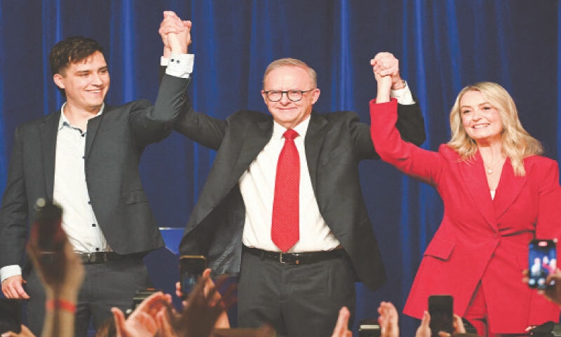 AUSTRALIAN PM Anthony Albanese gestures with his partner Jodie Haydon and son Nathan after winning the election.&mdash;AFP