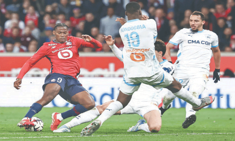 Villeneuve-d&rsquo;Ascq: Lille&rsquo;s Jonathan David (L) in action during the Ligue 1 match against Olympique de Marseille at the Pierre-Mauroy Stadium.&mdash;AFP