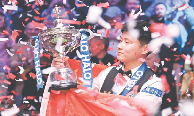 CHINA&rsquo;S Zhao Xintong poses with the World Championship Snooker trophy after defeating Mark Williams of the Wales in the final at The Crucible.&mdash;AFP