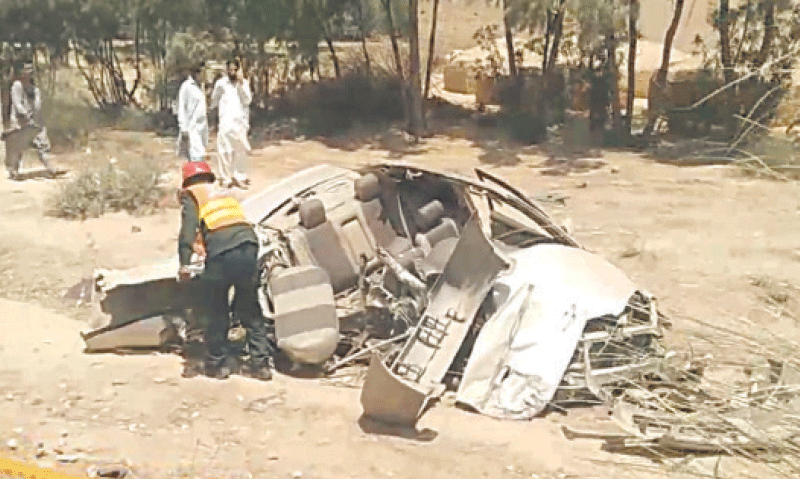 MIANWALI: Car mangled after collision with a bus and a tractor-trolley on Talagang Road.—Dawn MIANWALI: Car mangled after collision with a bus and a tractor-trolley on Talagang Road.—Dawn