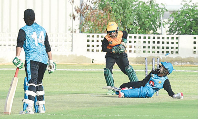 KARACHI: Stars wicket-keeper Sidra Nawaz celebrates after stumping Invincibles batter Omaima Sohail during their National Women’s T20 Cup match at the Oval Academy Ground of the National Bank Stadium on Saturday.—Tahir Jamal/White Star