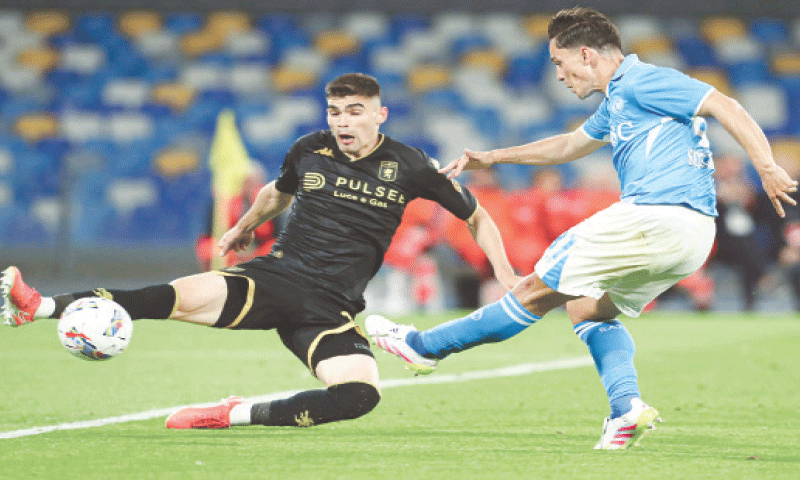 NAPLES: Napoli’s Giacomo Raspadori (R) shoots to score past Johan Vasquez of Genoa during their Serie A match at the Diego Armando Maradona Stadium.—AFP