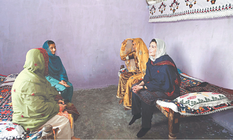 MNA Aseefa Bhutto-Zardari visits a flood-hit family rehabilitated in Mirza Farrukh Baig village on Monday.—Dawn